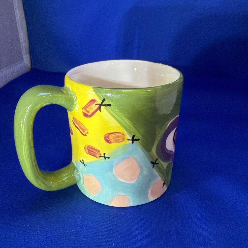 Vicki Carroll Studio Art Pottery Mardi Gras Mug from 1995.